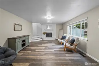 Cozy family room with fireplace just off of the kitchen. 13911 113th Ave Ct E, Puyallup, WA 98374