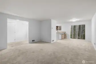 Open living area featuring soft natural light, neutral finishes