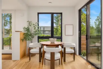 The dining room offers wonderful access to the front patio with a large sliding glass door, seamlessly blending indoor and outdoor living and creating an inviting space for al fresco dining and entertaining.