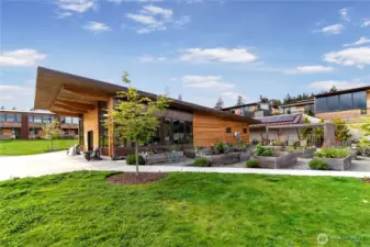 Shared gardens and green spaces unite neighbors with the natural surroundings, while the community center offers a space for social gatherings and events.