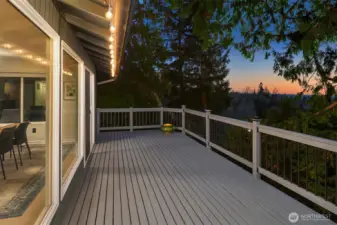 Spacious deck with gorgeous sunset and mountain views.