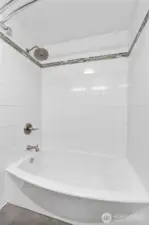 Guest bathroom also offers a tiled shower/tub combo.