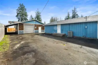 Fully finished and insulated 30x30 shop with its own commercial meter and 200-amp service, plus an attached 8x30 carport. Ample space for an RV and all your toys!