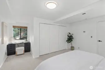 This bedroom features a charming nook, ideal for a work desk or cozy reading chair.