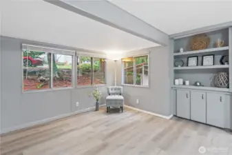 Bright and open entrance into living room with plenty of natural light.