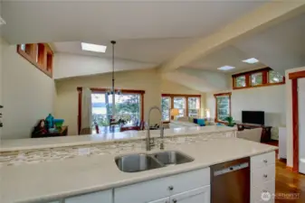 Solid surface counter tops with tile back splash and a great view from the SS sink.