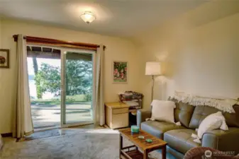Lower Level: Flex space with sliding glass door to patio and beach path.