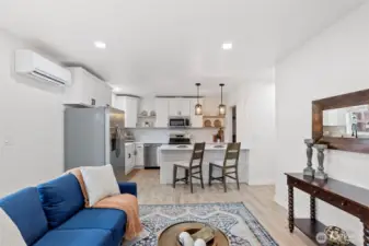 The main living space has just enough room to get comfortable. There is an entry closet to the right and sliding door to the left out to the private deck.