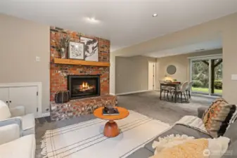 Recreation room with a gas fireplace and plenty of activity space.