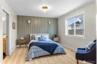 Large Primary Suite! Offers custom designer flair with this gorgeous accent wall and updated lighting!
