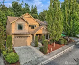 Two car garage with a third bay in tandem