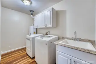 Utility Room with newer LG Washer & Dryer, and Tankless Water Heater...