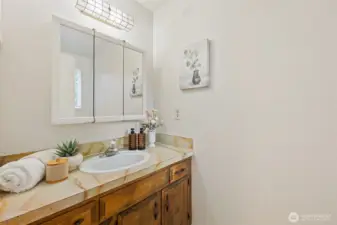 Half bathroom off primary bedroom.