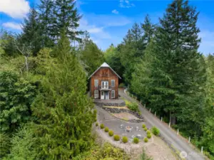 Perched at the top of 3.82 acres, this rustic home enjoys sweeping territorial and mountain views.