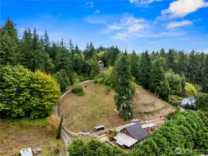 An aerial photo shows the home and expansive pastoral beauty of this property. The barn and multiple out-buildings round out this amazing offering.