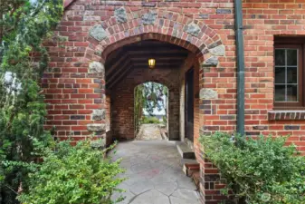 “Inviting portico leads to the front door, highlighting the home’s classic architectural details and entryway charm