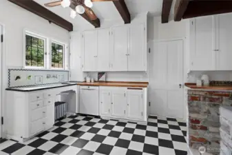 Original kitchen with classic cabinetry and historic details, preserving the home’s authentic charm and timeless character.