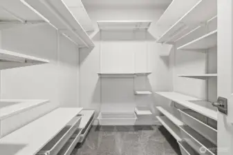 Spacious closet off primary bedroom with lots of storage.