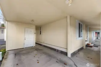Covered walkway from the Carport and Shed in the Carport and the walkway to the Front Door.