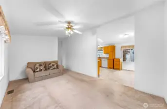 Living Room with entrance to the Kitchen and Dining Area.