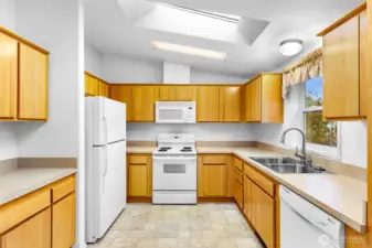 Large spacious well lighted Kitchen with a Skylight. Tons of space for entertaining.