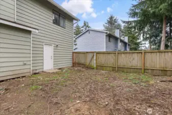 Backyard has garage access, as well as a side gate.