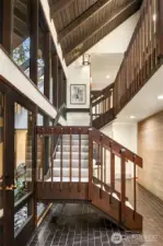 Skylights, floor to ceiling windows, natural wood, tile floors