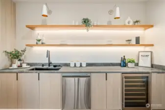 Lower-Level wet bar complete with sink, beverage fridge, and dishwasher