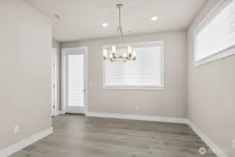 Dining area opens to the patio with the huge covered Trex deck spanning the full width of your home!