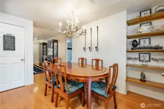Another view back towards the living room. See pantry in the kitchen.