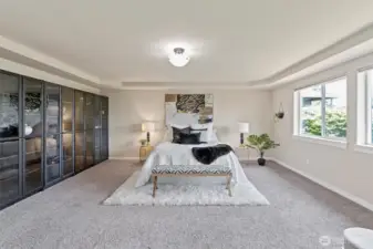 Spacious primary bedroom with stunning water views.