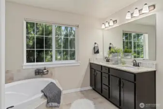 A spa-like 5-piece primary ensuite bath.