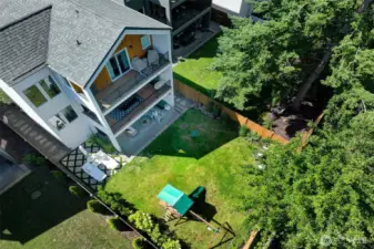 Large backyard, fully fenced in with English garden feel, mature lawn and landscaping, covered patios on all 3 floors with built-in outdoor heaters on the lower level and main level