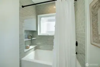Upper level bathroom with bathtub and shower, Bedrosian tile, built-in shelves