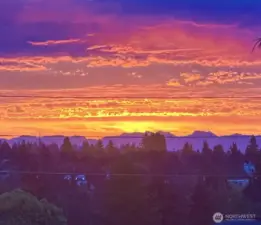 Cascade mountains at sunrise (view from upper floor patio) - picture taken by homeowner