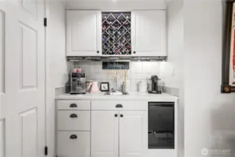 Additional wet bar with second sink, wine storage & mini fridge!