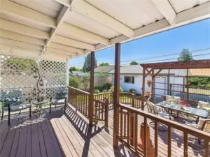 This back yard is the perfect NW back yard. Covered area for those days when the sun is blazing down or when it rains. Uncovered deck for when you want to work on your tan or eat outside al fresco.