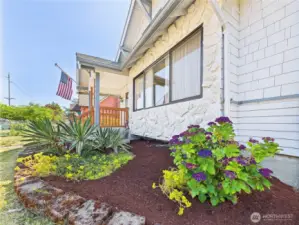 Refreshed landscaping frames this beautiful home.