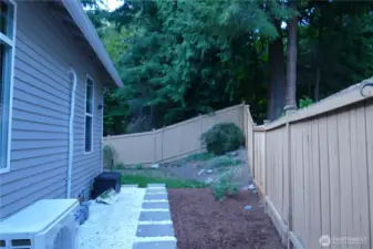 Landscaped side yard with full fence