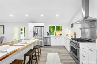 Completely renovated in 2023, the home features a gourmet chef’s kitchen with cathedral ceilings, a butcher block island, quartz countertops, stainless steel appliances, and a large walk-in pantry.