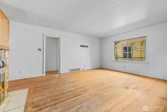 Living room area on main floor with wood floors and natural light.