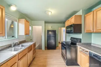 Kitchen ready for full remodel—solid footprint and good flow to dining area.