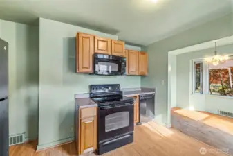 Kitchen view showing layout and cabinetry—ripe for renovation or reconfiguration.