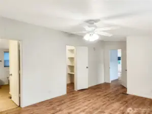 This generous primary suite includes dual closets for excellent storage and a 5-piece bath designed for relaxation with a soaking tub and large vanity for storage.