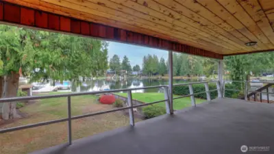 Start each day with captivating lakefront sunrises viewed from your covered porch oasis