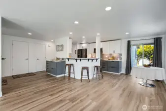 The eat-in kitchen features a casual dining area and a bar that provides additional seating, making it ideal for everyday means and entertaining.