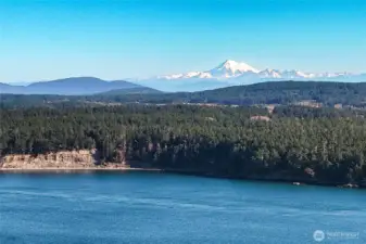 Spectacular regional views featuring expansive water vistas and distant snow-capped mountains — a reminder of the incredible surroundings near this build-ready property.