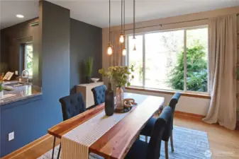Stylish dining area with designer lighting and seamless connection to the kitchen for easy entertaining.