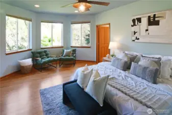 Private primary retreat with sitting area, large windows, and easy single-level comfort.