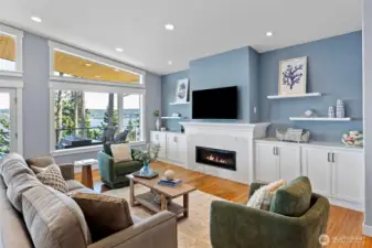 Great room with modern fireplace and hardwoods throughout the home.